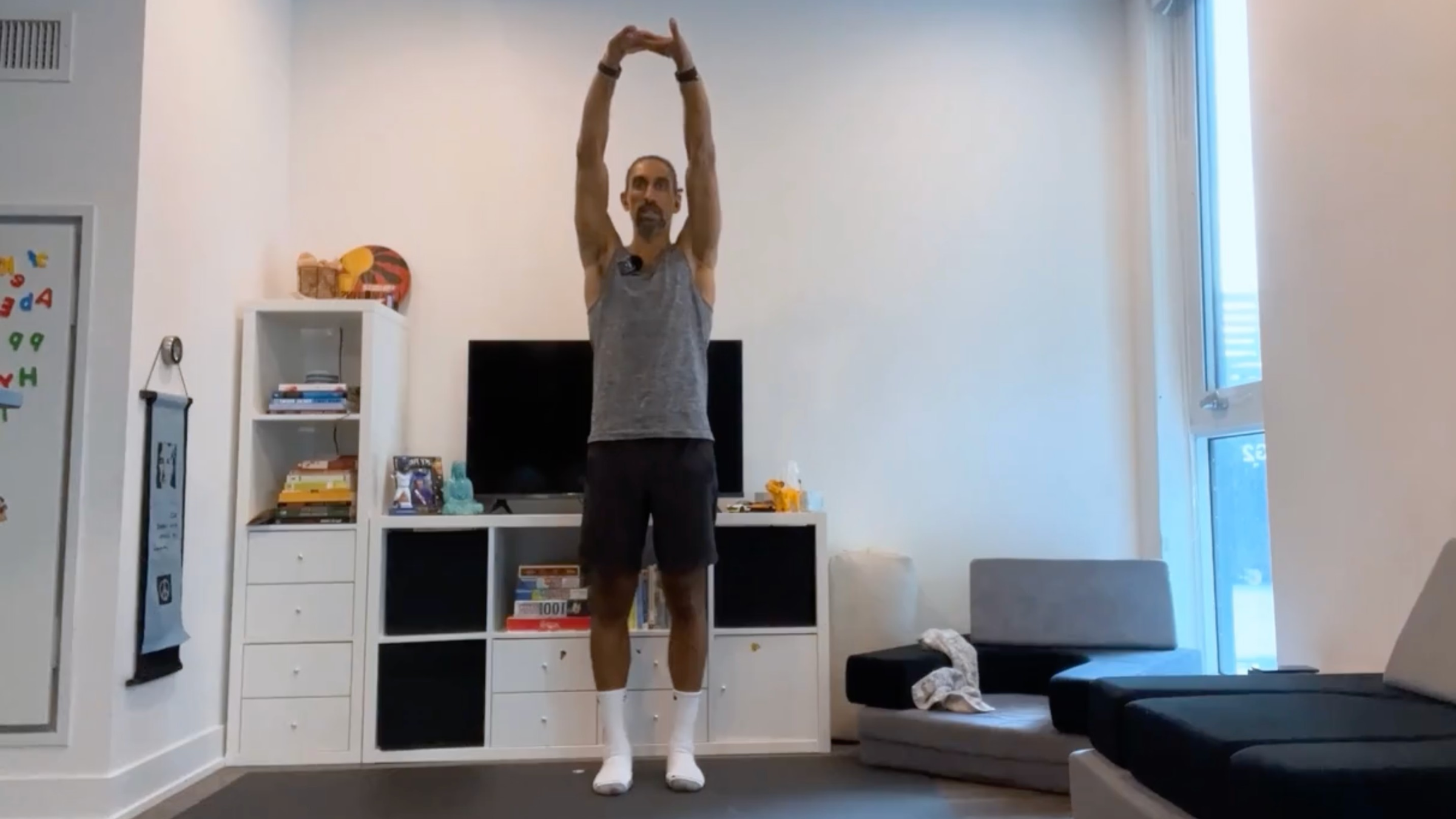 Yoga teacher Jaffer Hussain in a variation of Upward Salute, Urdhva Hastasana in Sanskrit, part of his yoga for posture practice